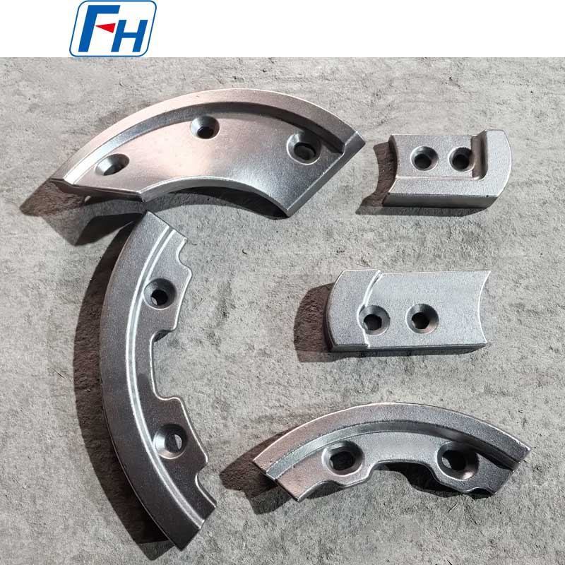Fabricant de pièces pour bétonnière FH® | Lames résistantes à l'usure pour les cimenteries